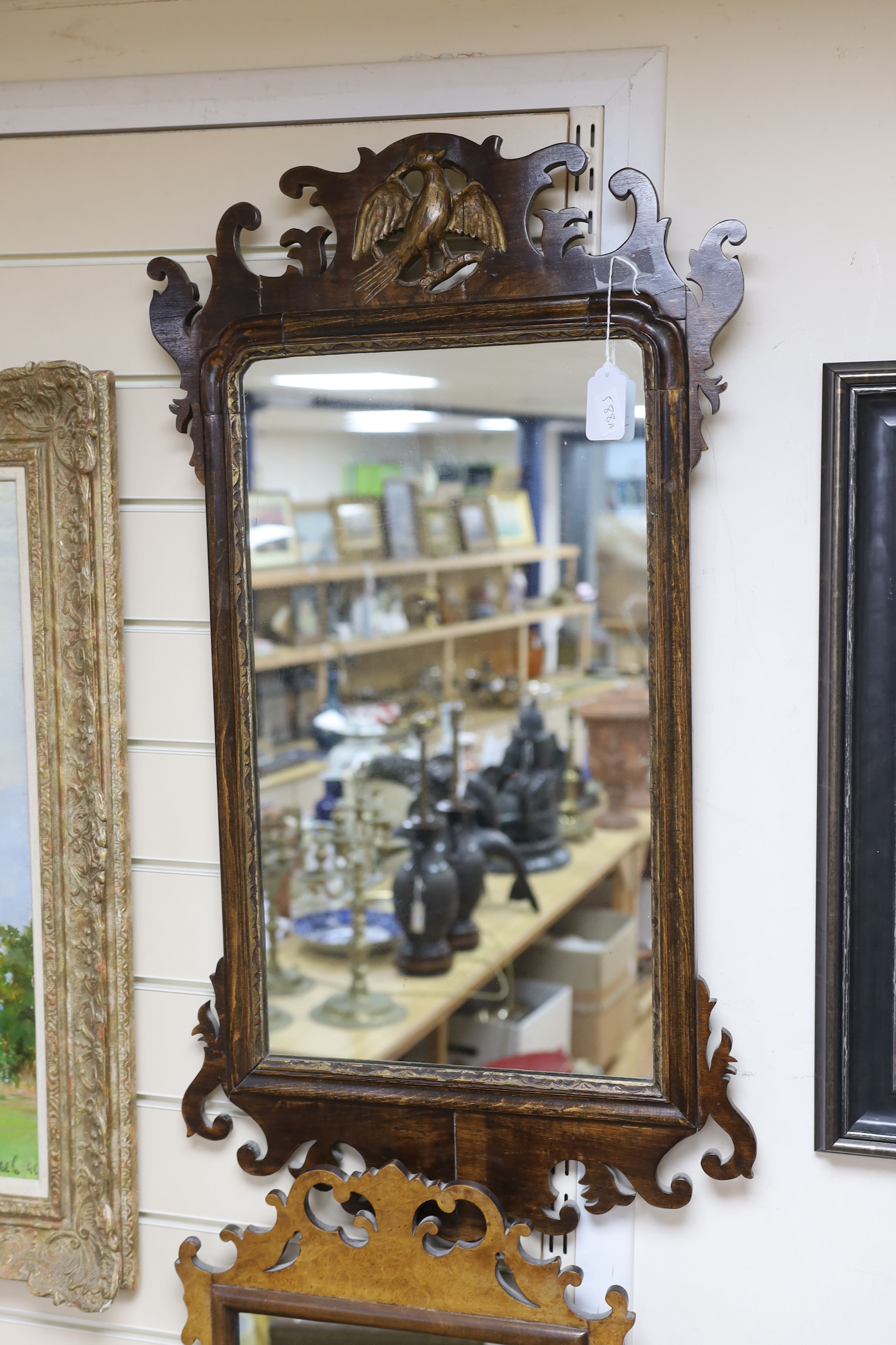 Two George III style fret cut wall mirrors, one with eagle surmount, tallest 85cm